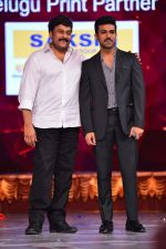 Chiranjeevi with son Ram Charan on stage at the Maa awards in HICC Hyderabad on 12th June 2016